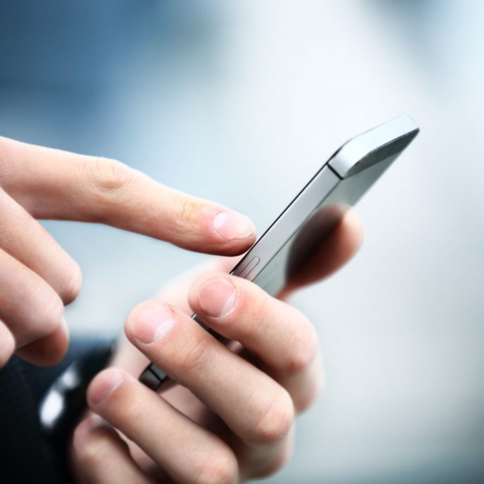 Close up of a man using mobile smart phone Close up of a man using mobile smart phone