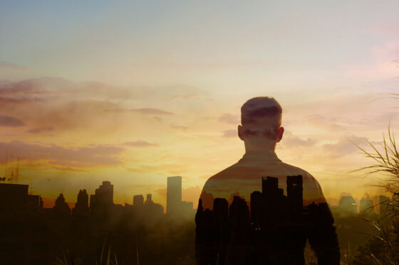 Man overlooking a city skyline
