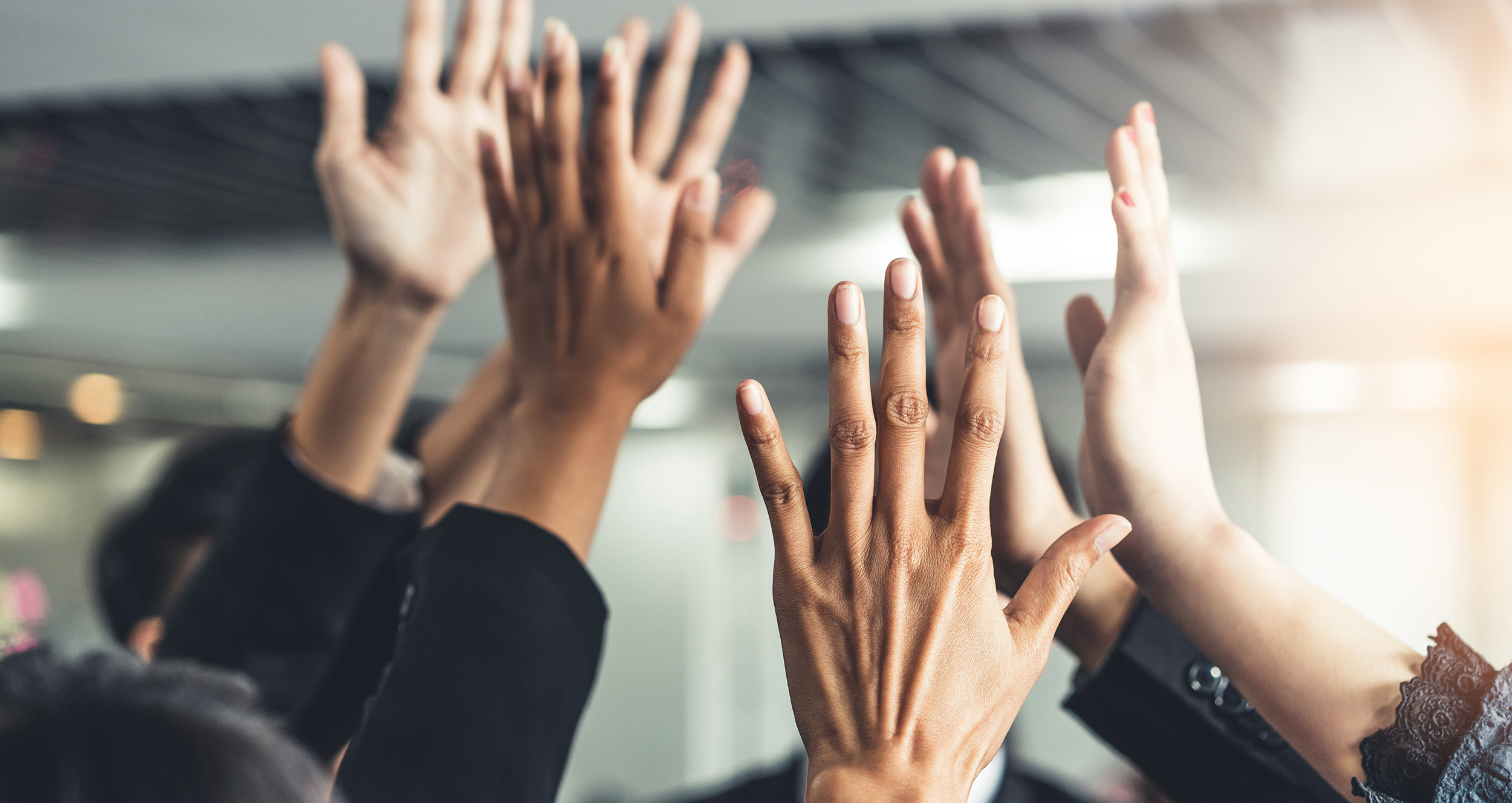 Group of hands raised in the air