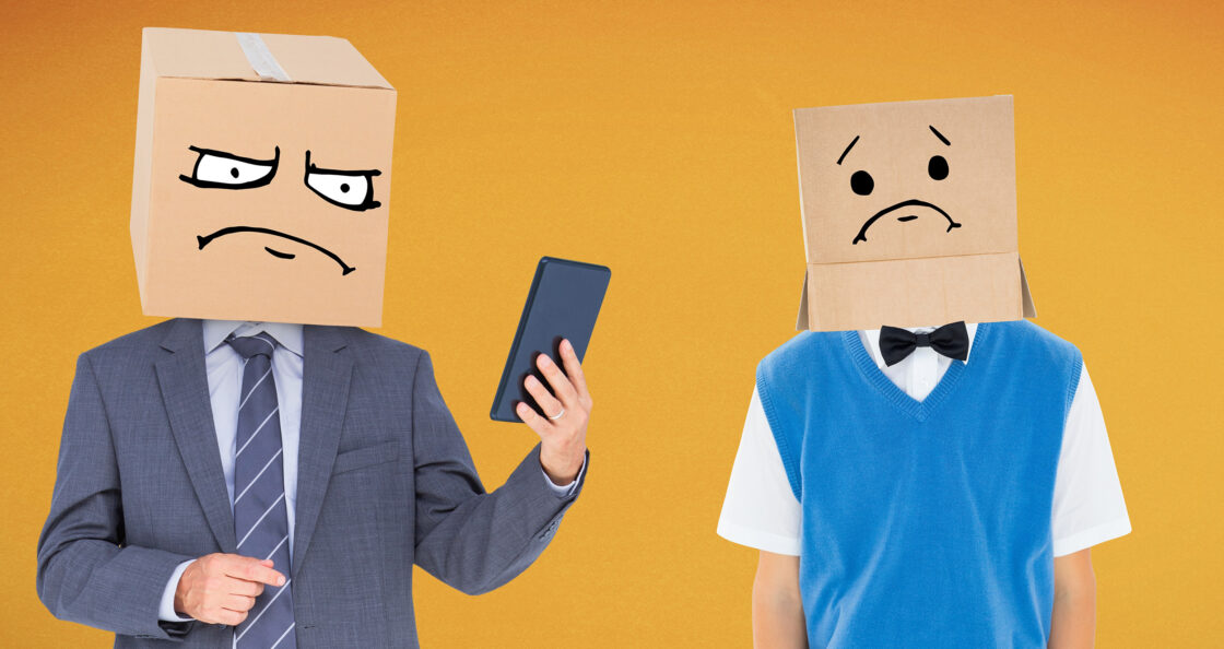 Business leader and employee with boxes over their head