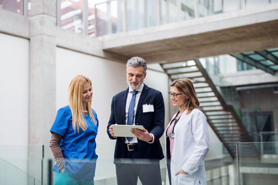 3 pharmacist looking at a clipboard
