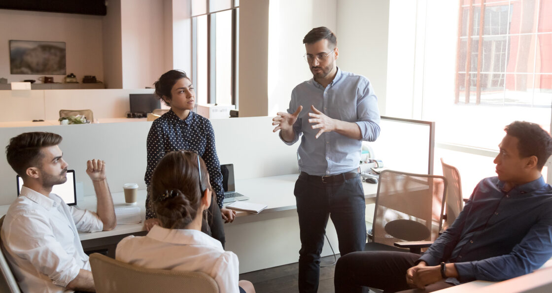 sales leader speak to team in casual work setting
