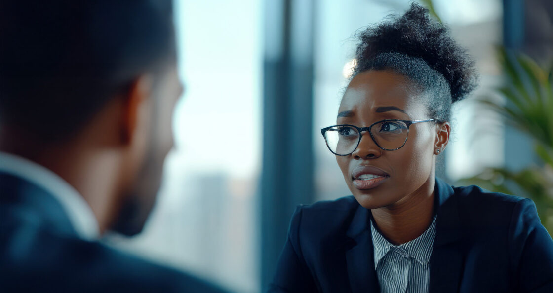 Female Leader coaching a male team member