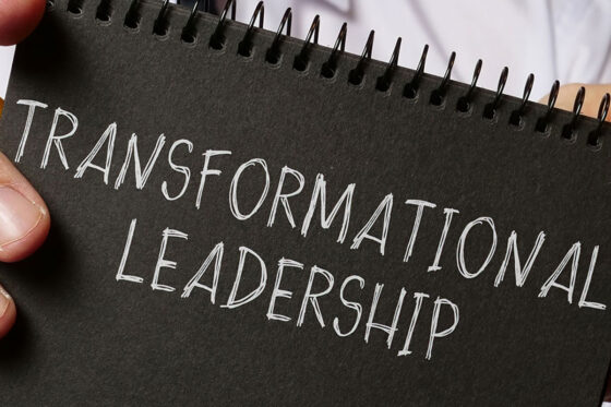 Transformational Leadership written on the front of a notebook