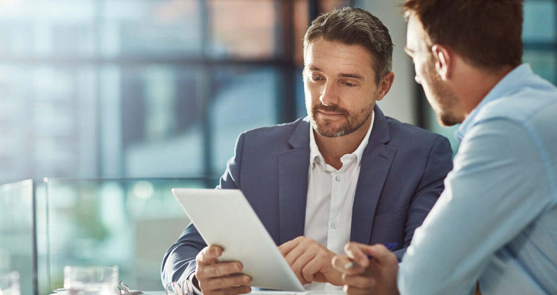Sales leader coaching a team member, discussing strategy and performance insights to drive long-term success in life sciences sales.