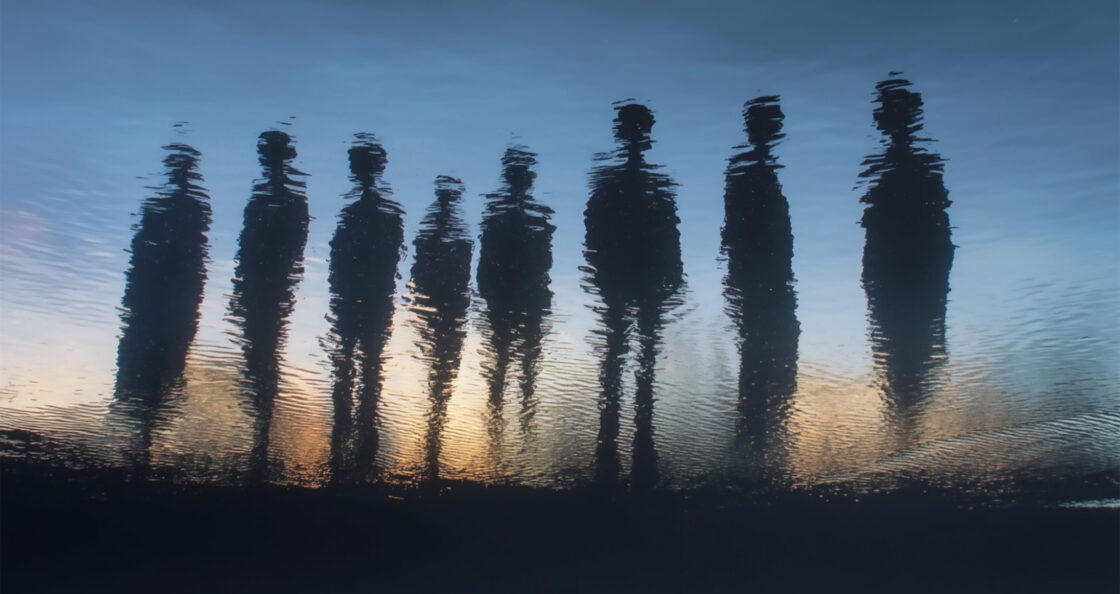 human silhouettes through water